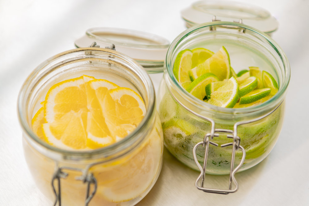 Neptune Bars sliced lemon and limes in jars