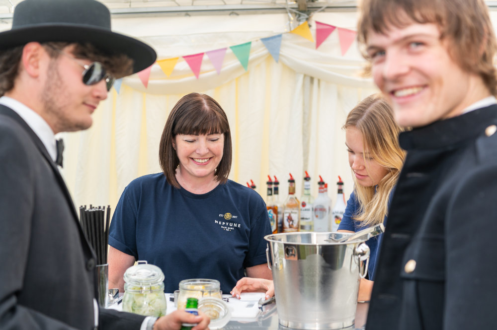 Neptune Bars staff serving young guests